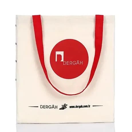 promosyon krem ham bez çanta, kırmızı oval logo baskısı, kırmızı uzun dokuma kulplu