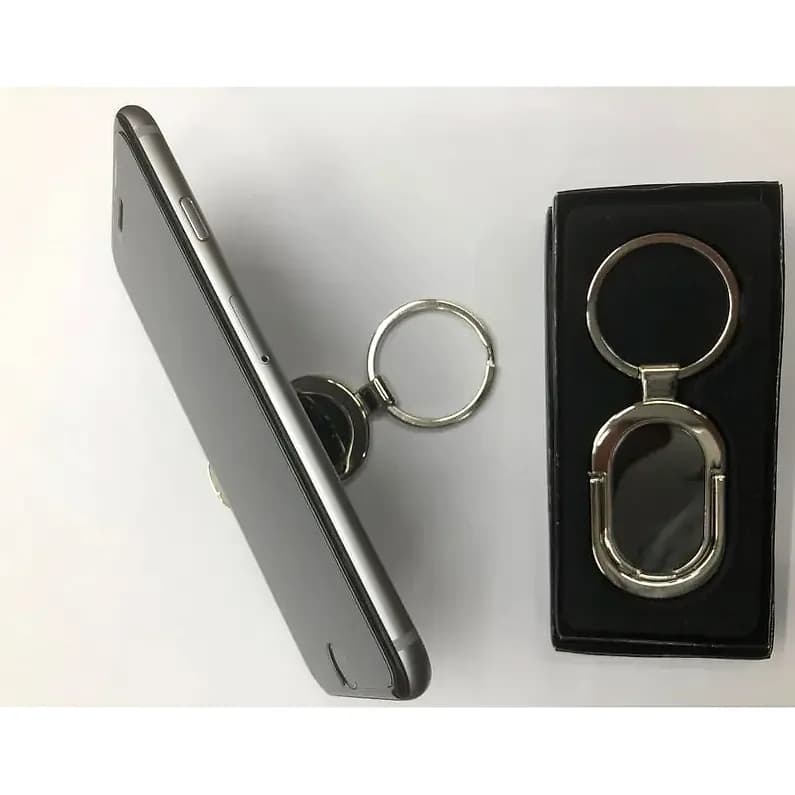 promosyon iki gümüş metal telefon tutucu, biri siyah kutuda, biri gri telefon arkasında